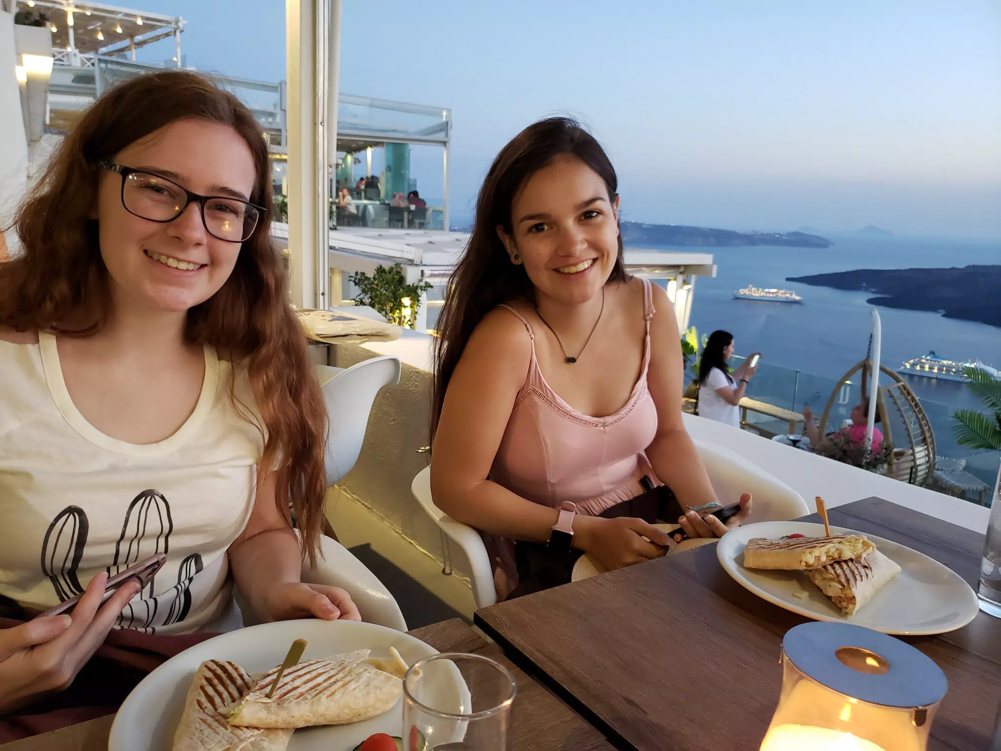Madeline and Emily Eating in Thera Santorini