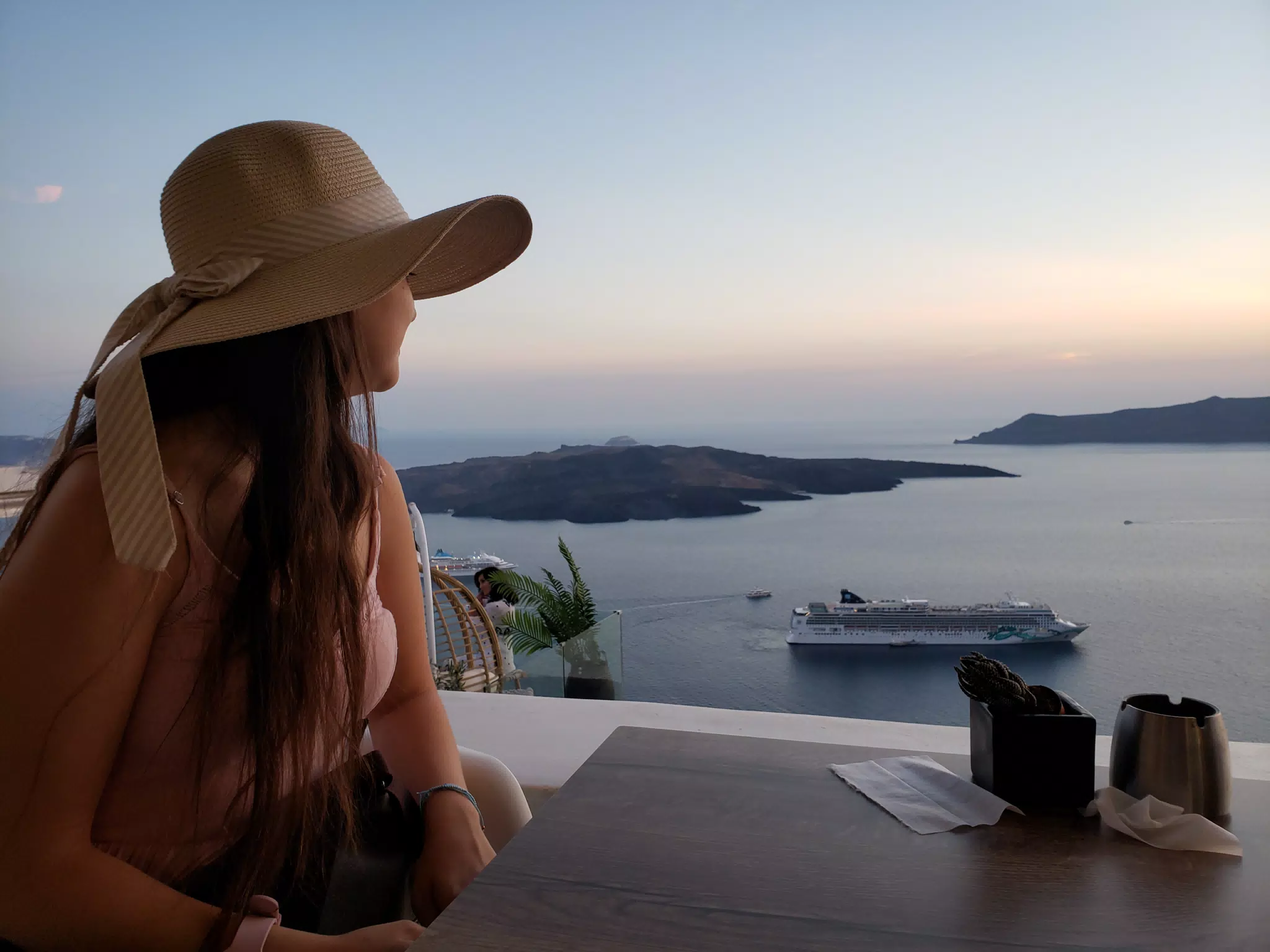 Emily Looking at Thira Sunset on the Aegean Sea in Santorini