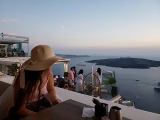 Girl Looking Out to the Horizon in Thira
