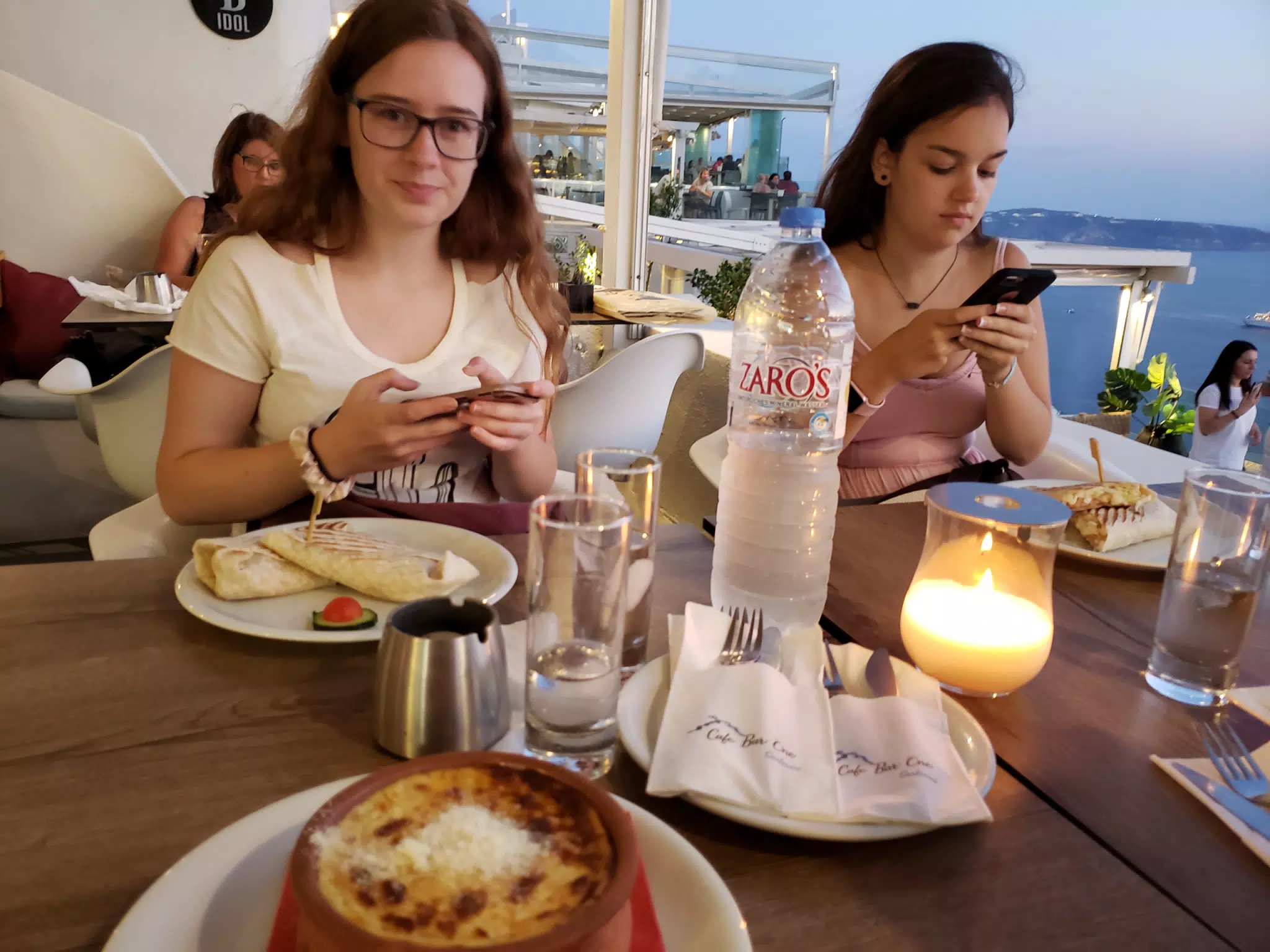 Girls Instagramming Food in Thira, Santorini