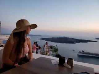 Emily at Restaurant in Thira Looking Out to Sea
