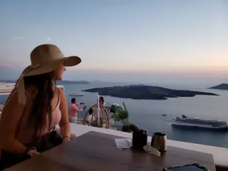 Emily at Restaurant in Thira Looking Out to Sea