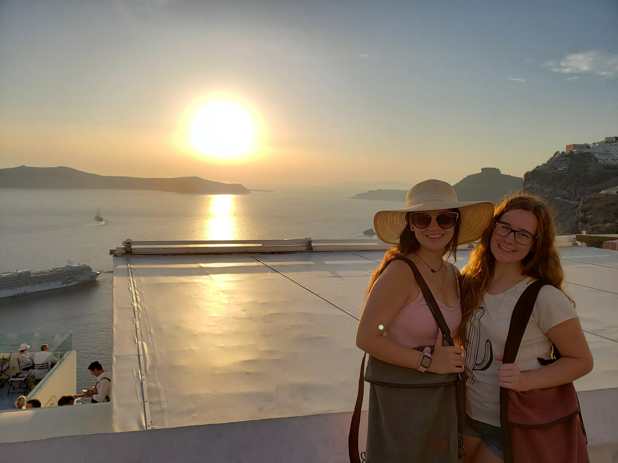 Emily and Madeline with a Sunset on Santorini in Thira