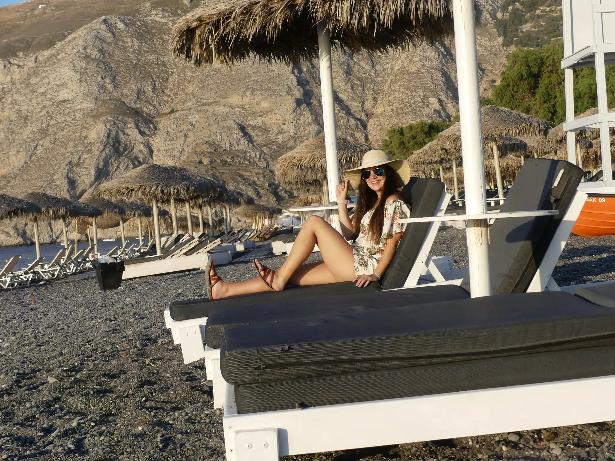Emily on Lounge Chair on Santorini Beach