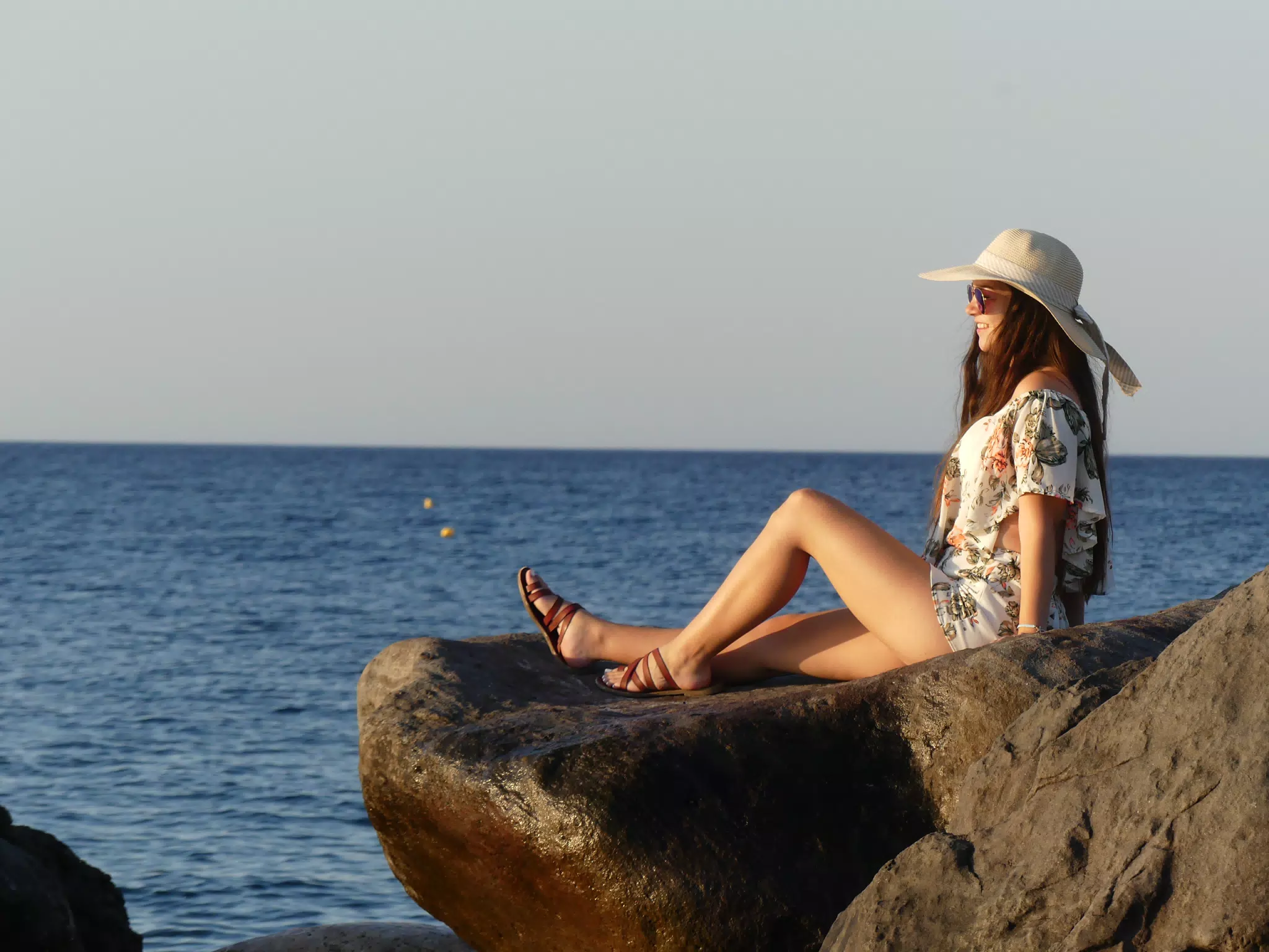 Girl by the Sea on Santorini at Sunrise