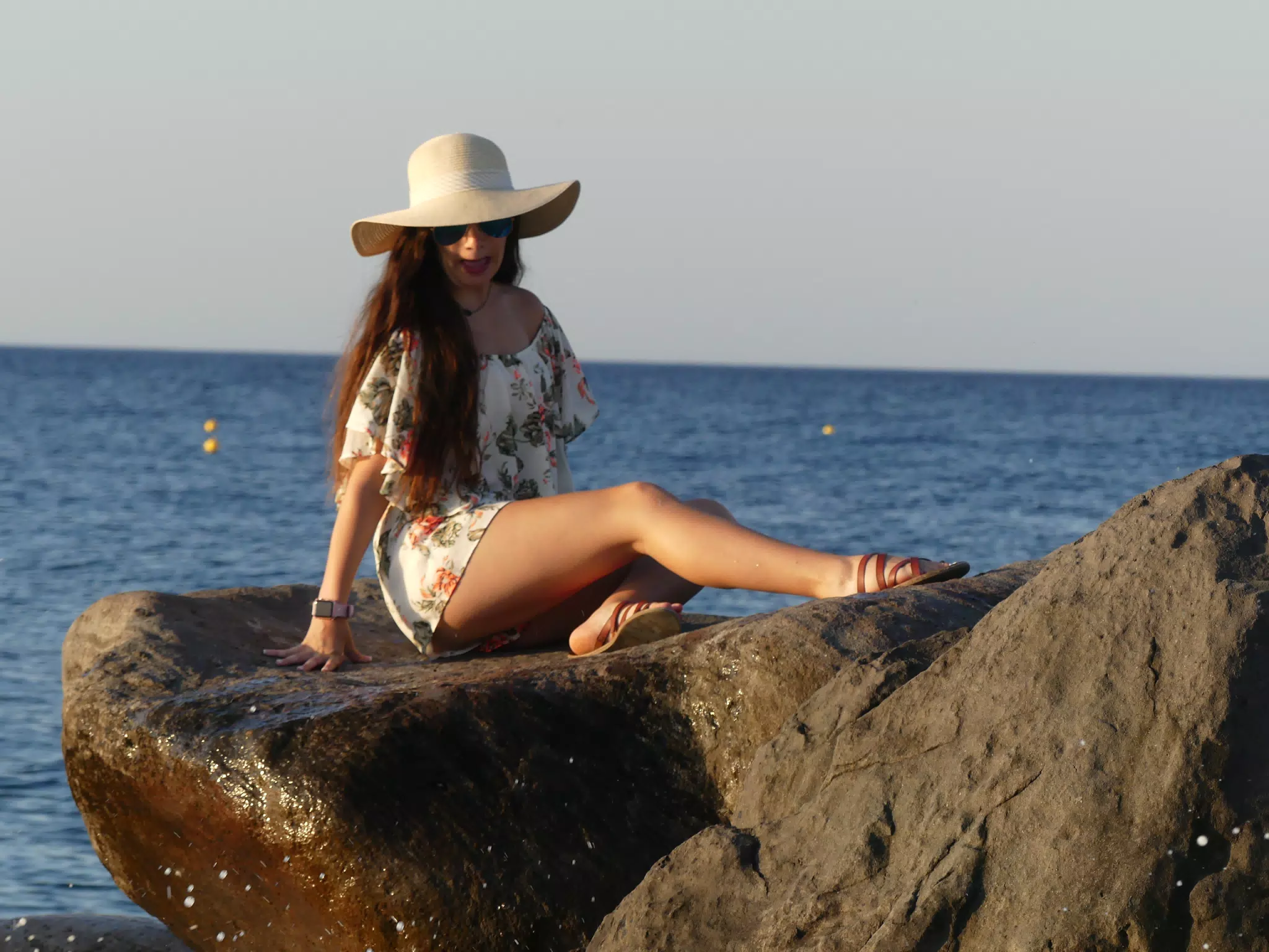 Goofy Girl on Rocks on Santorini