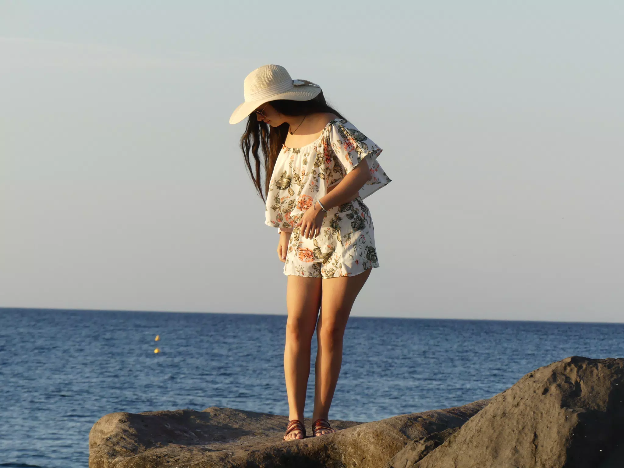 Emily on the Rocks on the Kamari Beach on Santorini