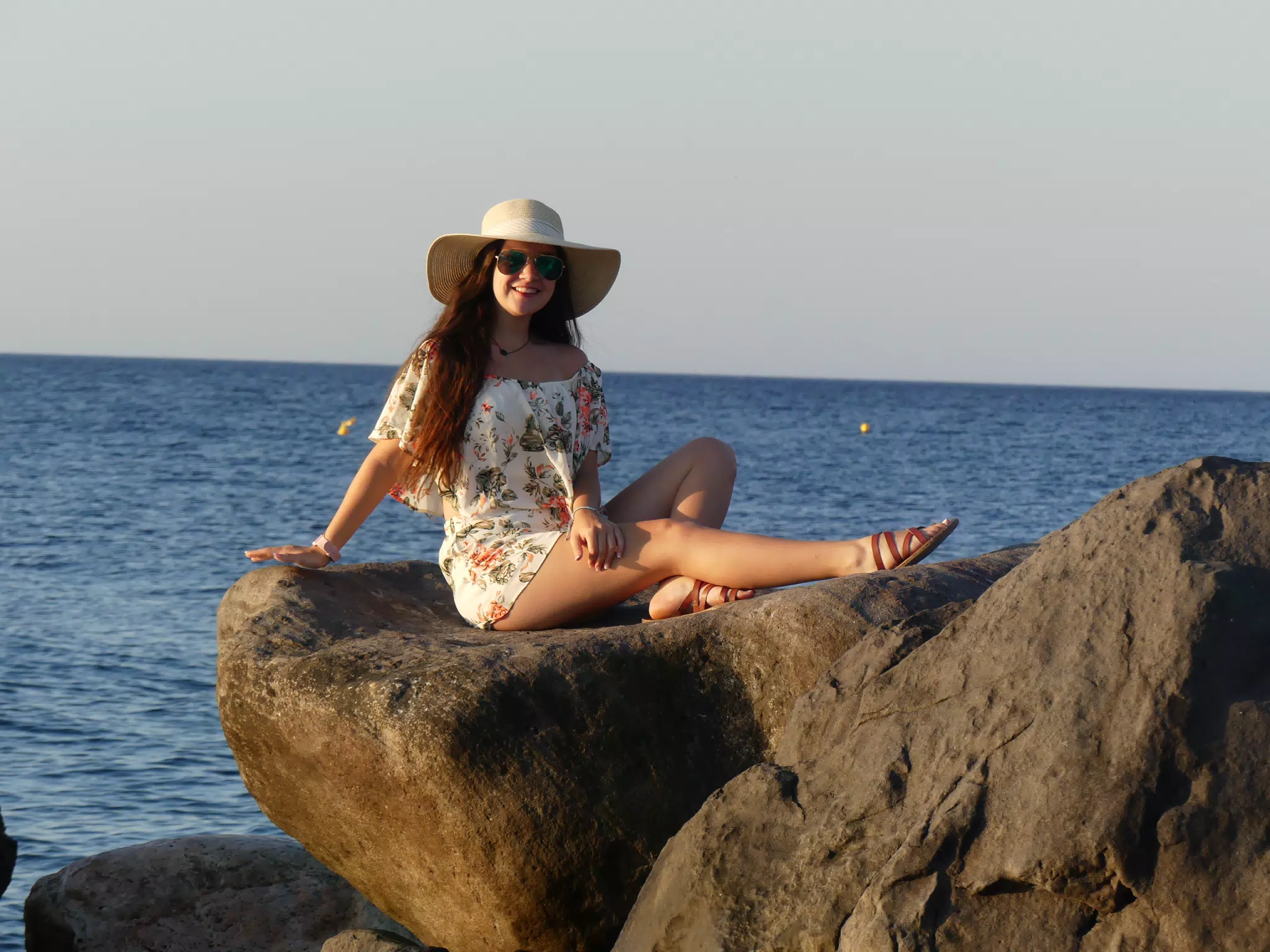 Emily Sitting on Rocks in the Santorini Sunrise