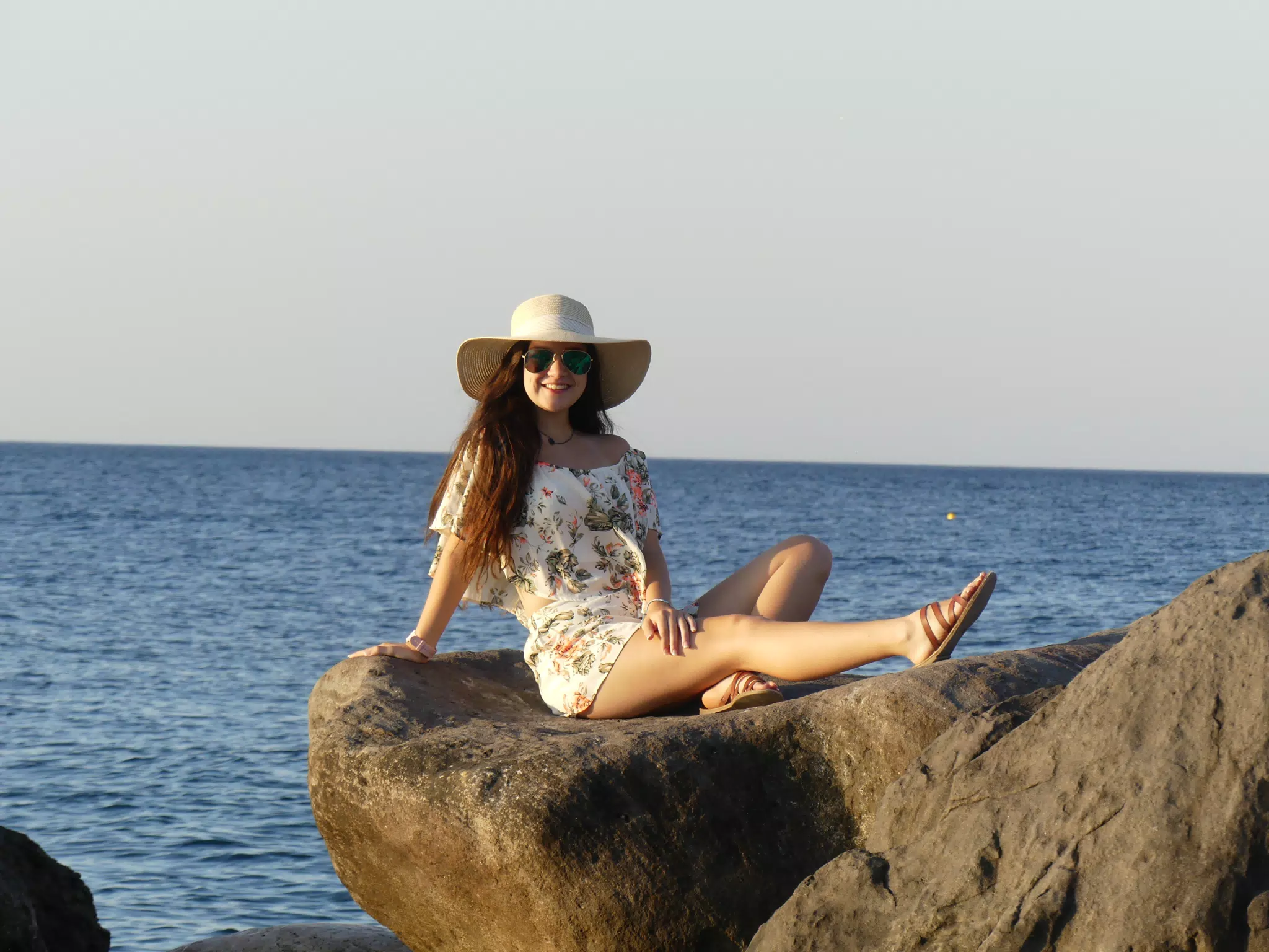 Girl Basking in Sunrise on Beach on Santorini