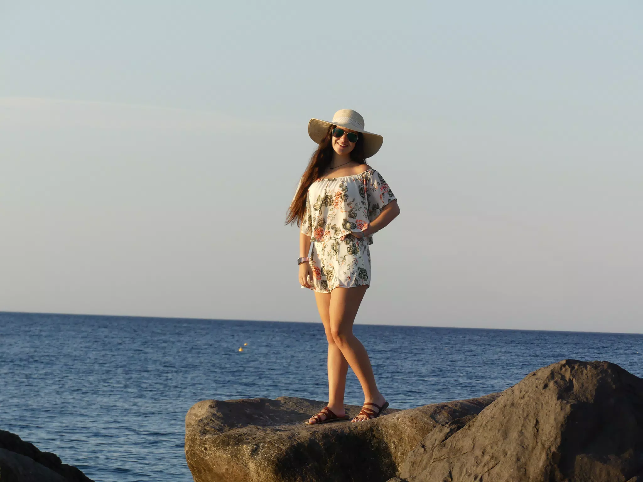 Emily Posing on the Rocks on the Beach at Kamari, Santorini, Greece