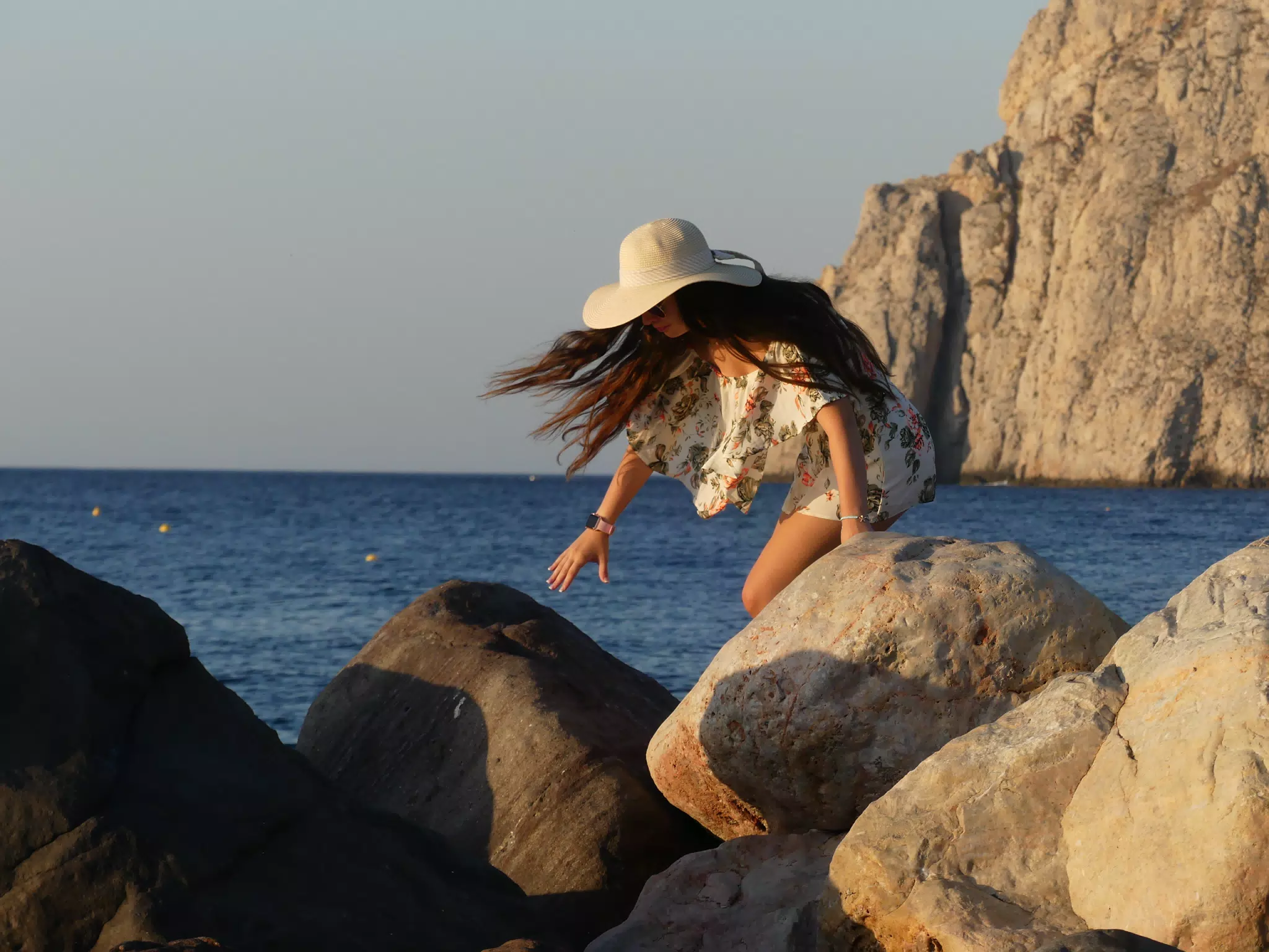 Emily Climbing the Rocks on the Beach at Kamari, Santorini