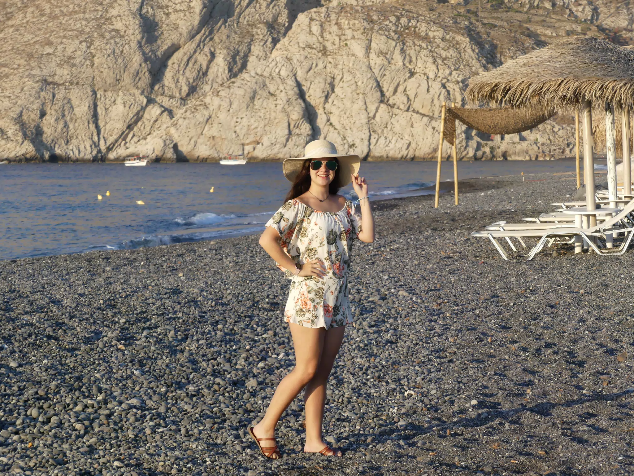 Girl on Santorini Beach in Hat