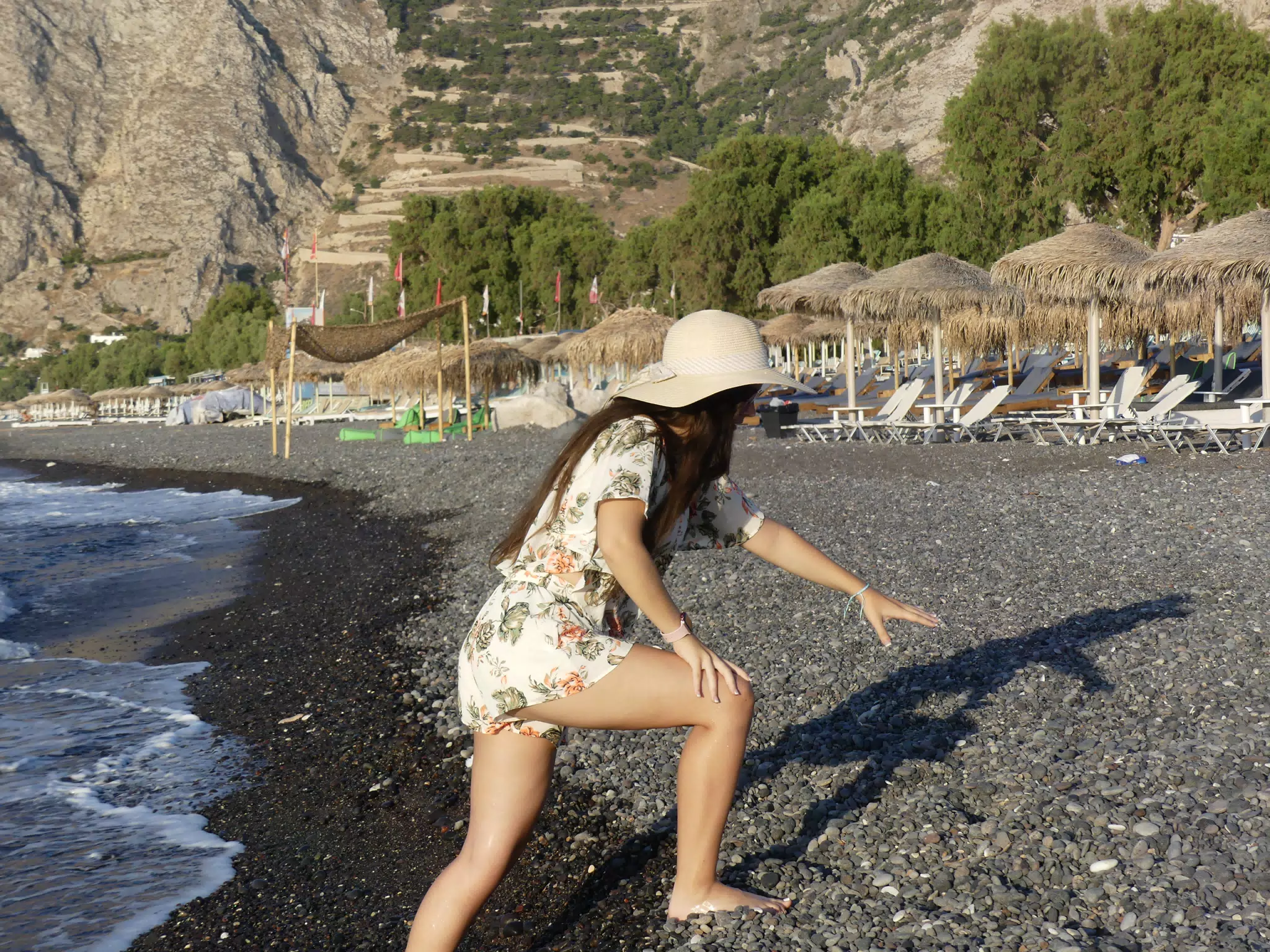 Emily Attempting to Climb the Kamari Beach on Santorini