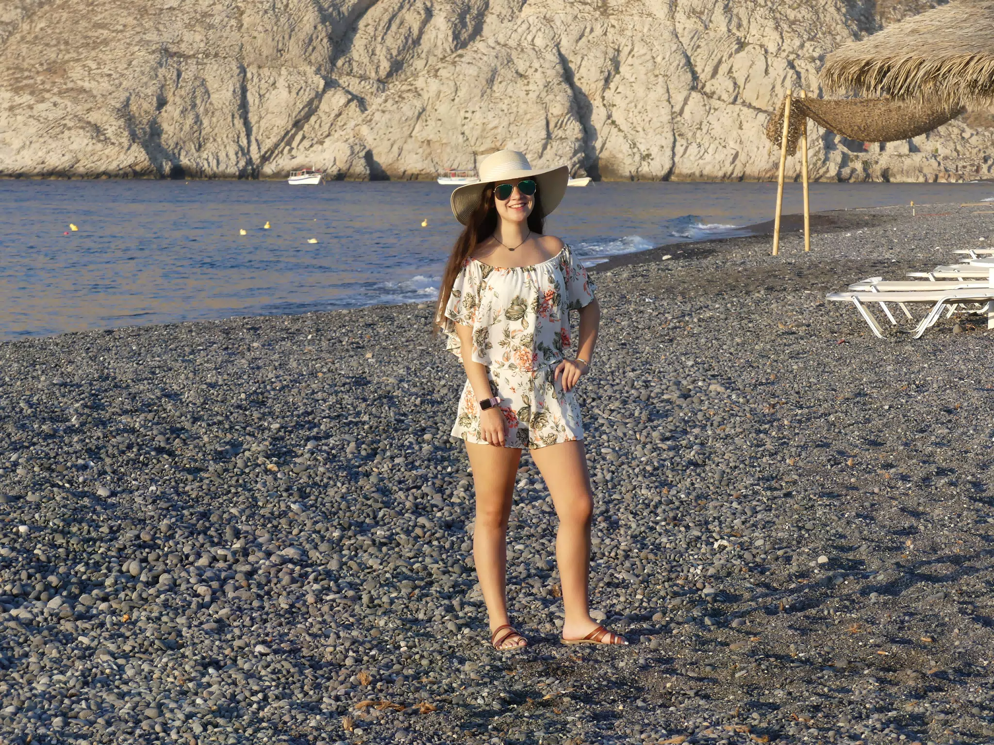 Girl in Hat on Beach at Kamari, Santorini, Greece