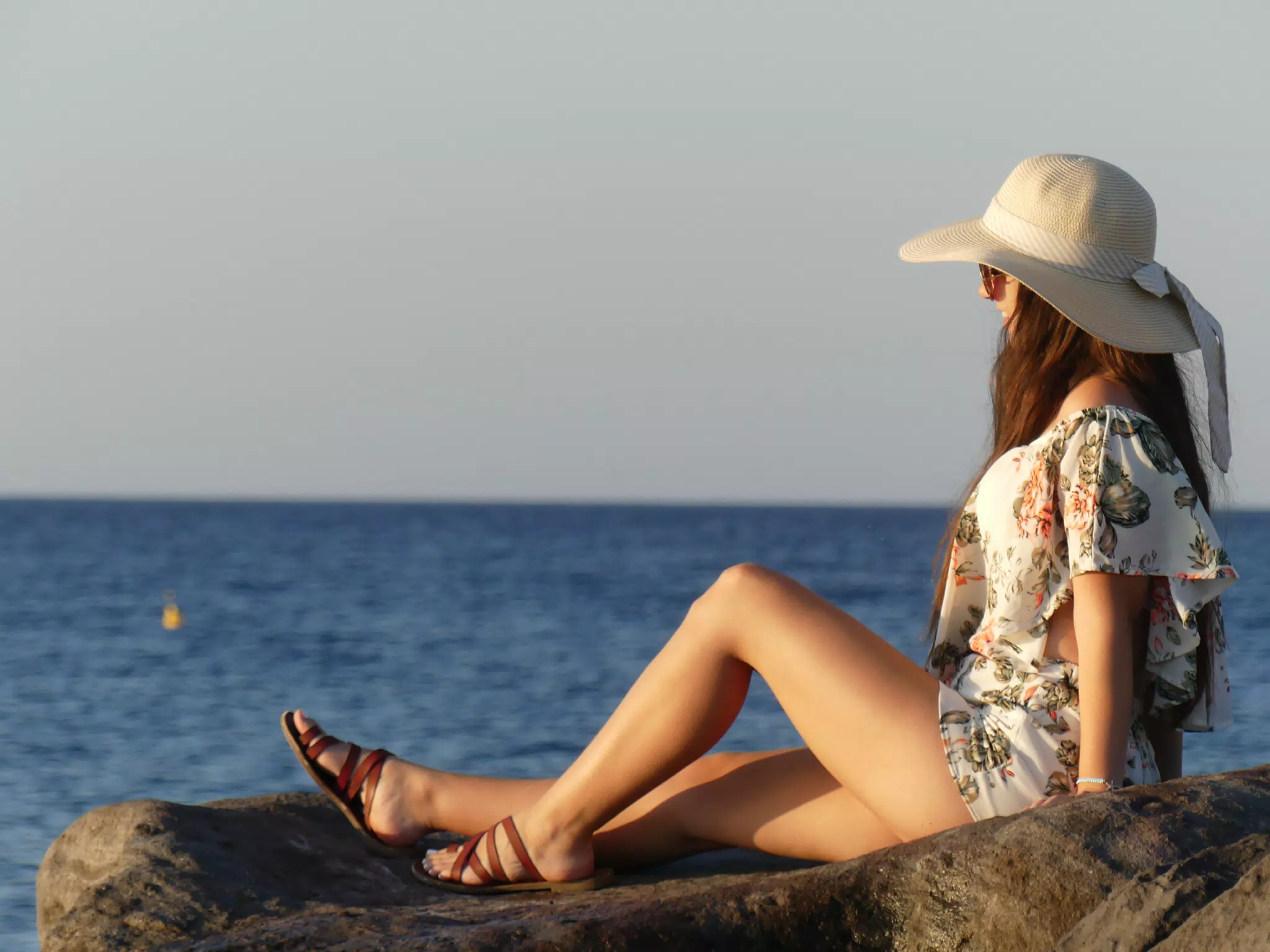Girl on Beach on Santorini Watching the Sunrise