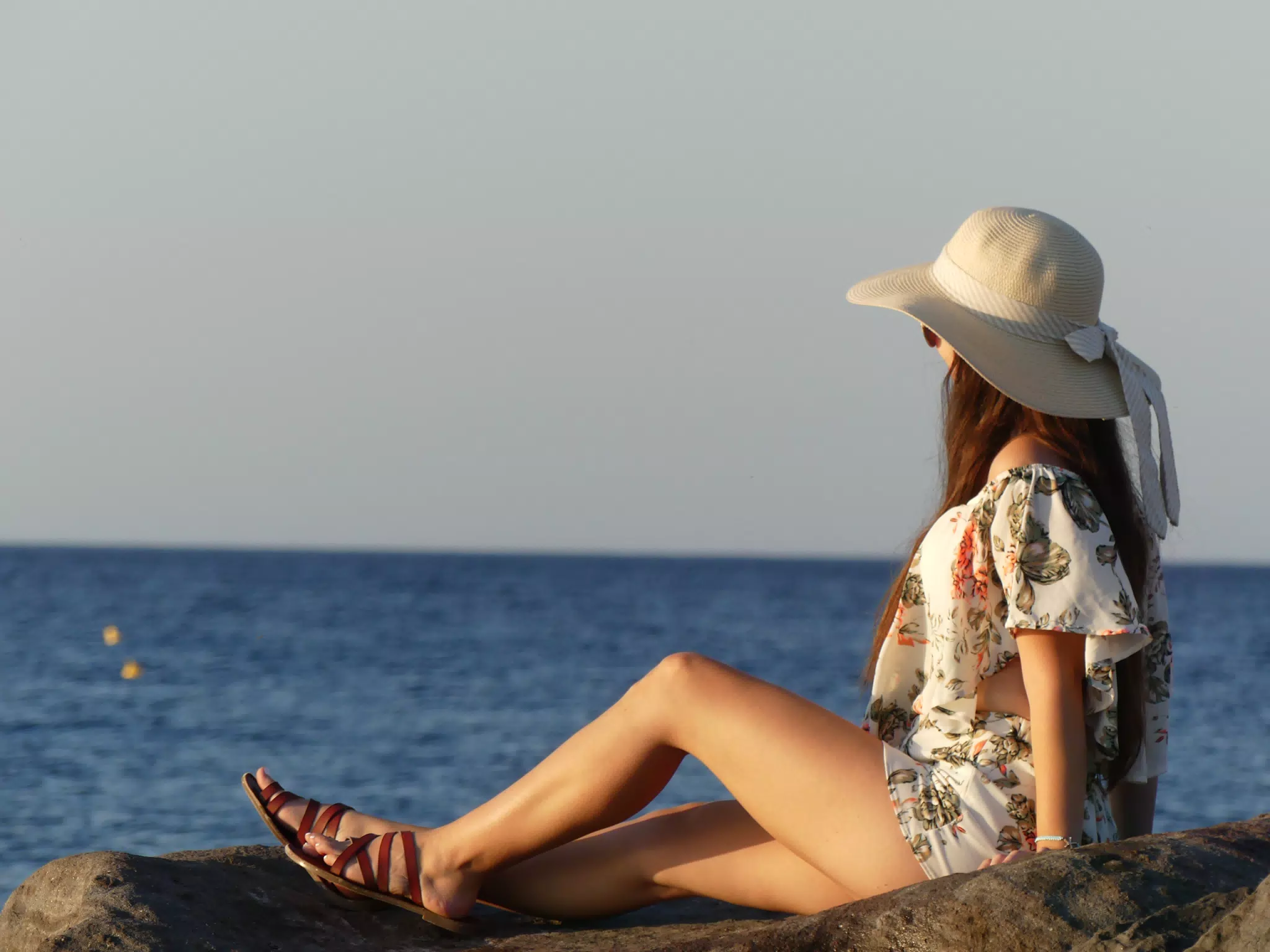 Girl Watching Sunrise on Santorini Beach