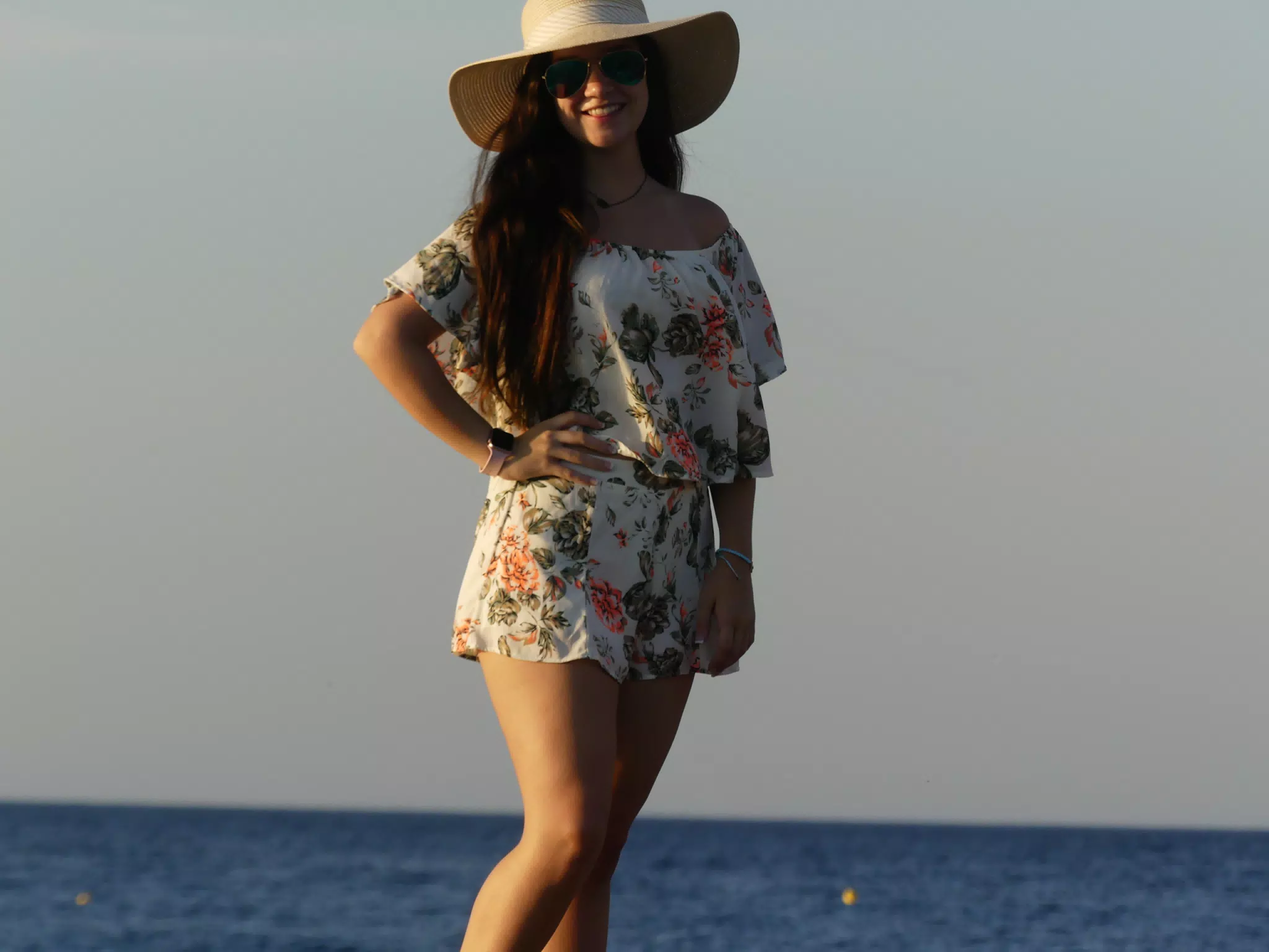 Emily Posting on the Rocks on Santorini