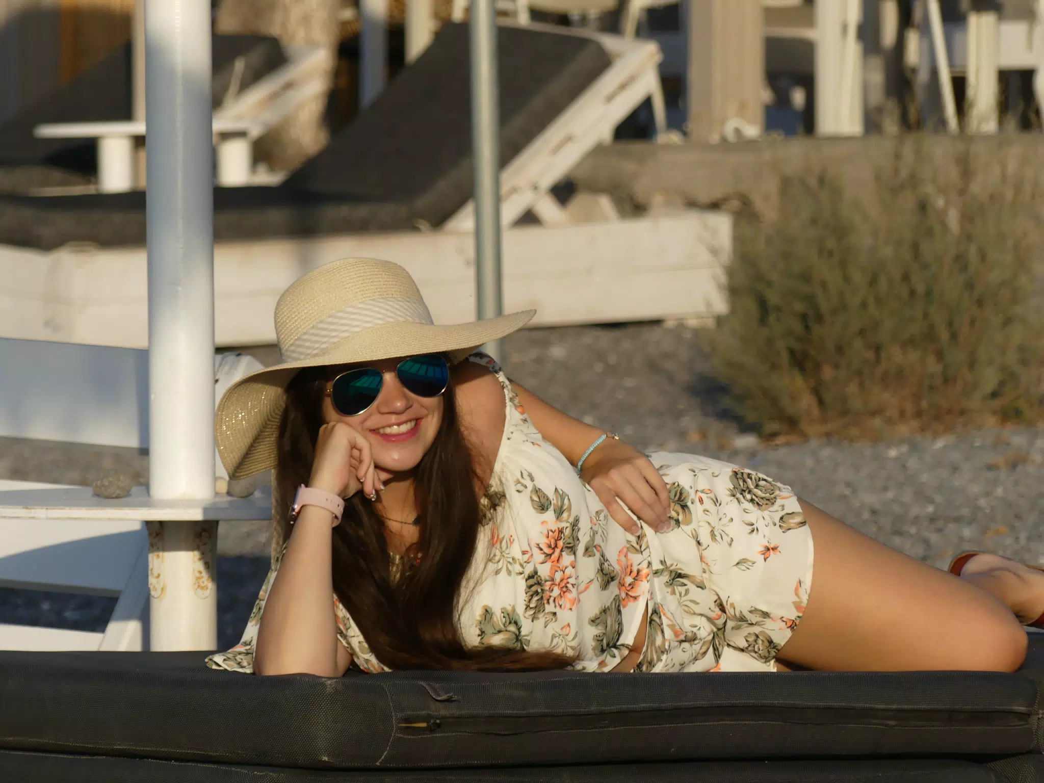 Emily Laying on Lounge Chair on Santorini Beach
