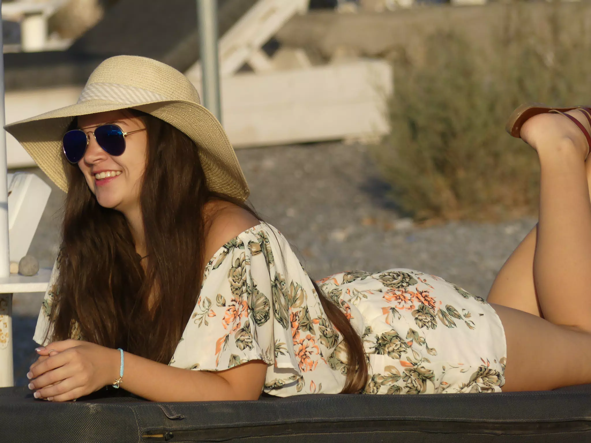 Emily Lounging on Santorini Beach at Sunrise