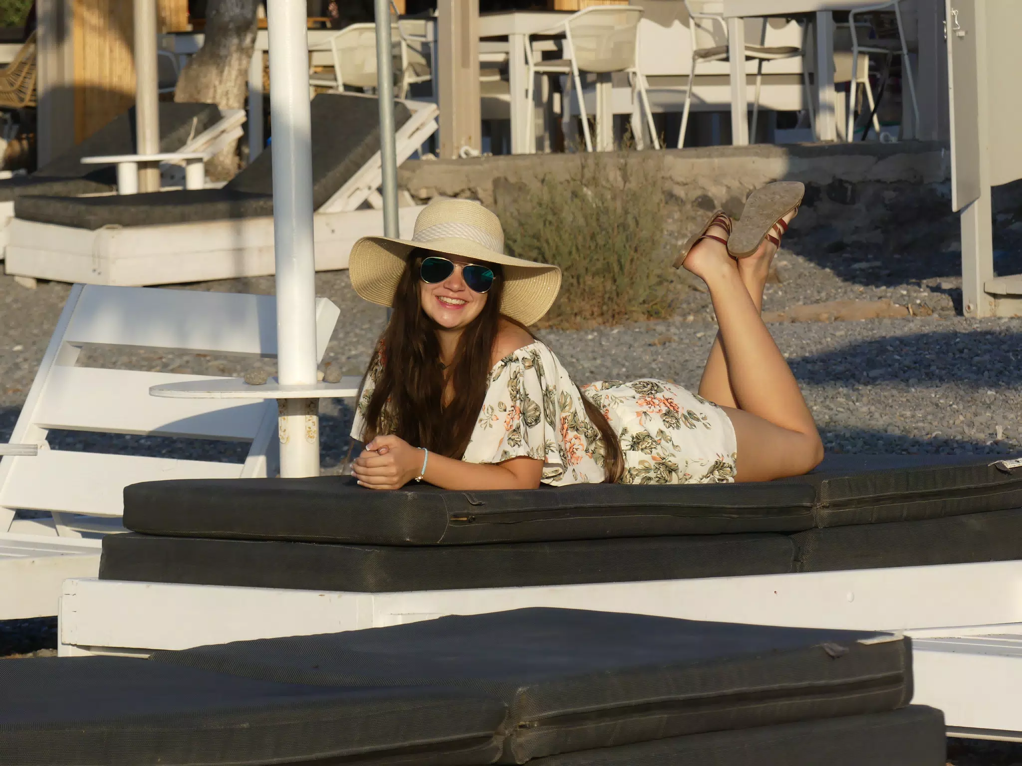 Emily Laying on Lounge Chair on Santorini Beach