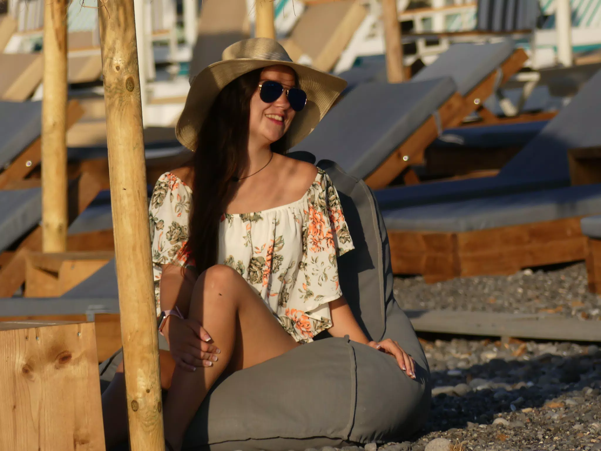 Emily Enjoying Cushion Seat on Kamari Beach, Santorini
