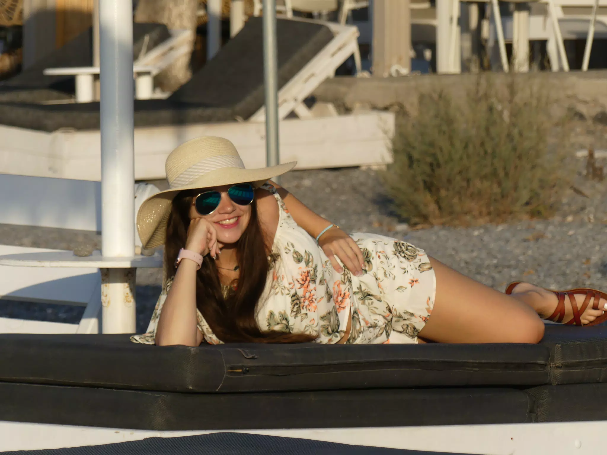 Emily Laying on the Beach at Santorini