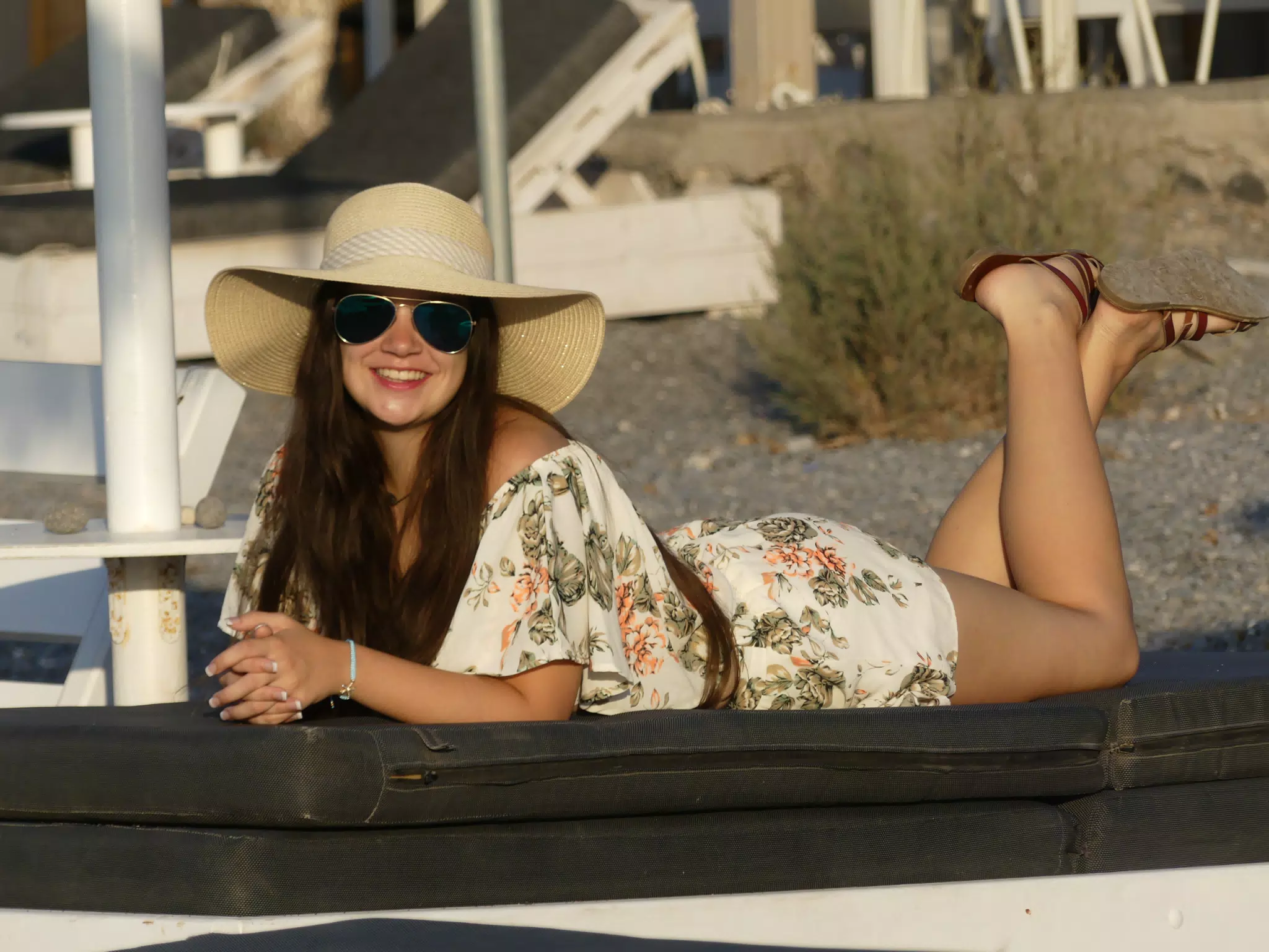 Emily Laying on Reclining Chair on Santorini Beach