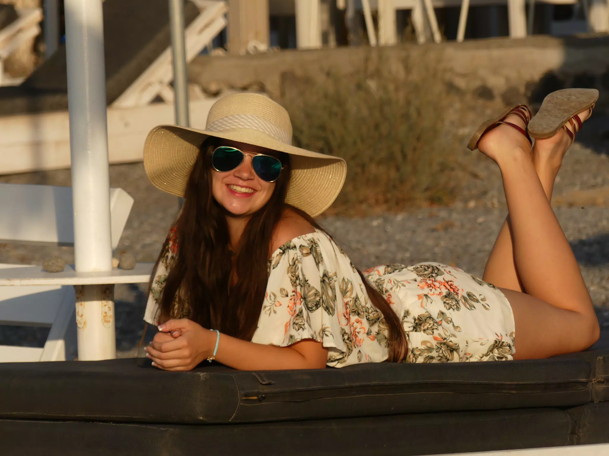 Emily Laying on Lounge Chair on Santorini Beach