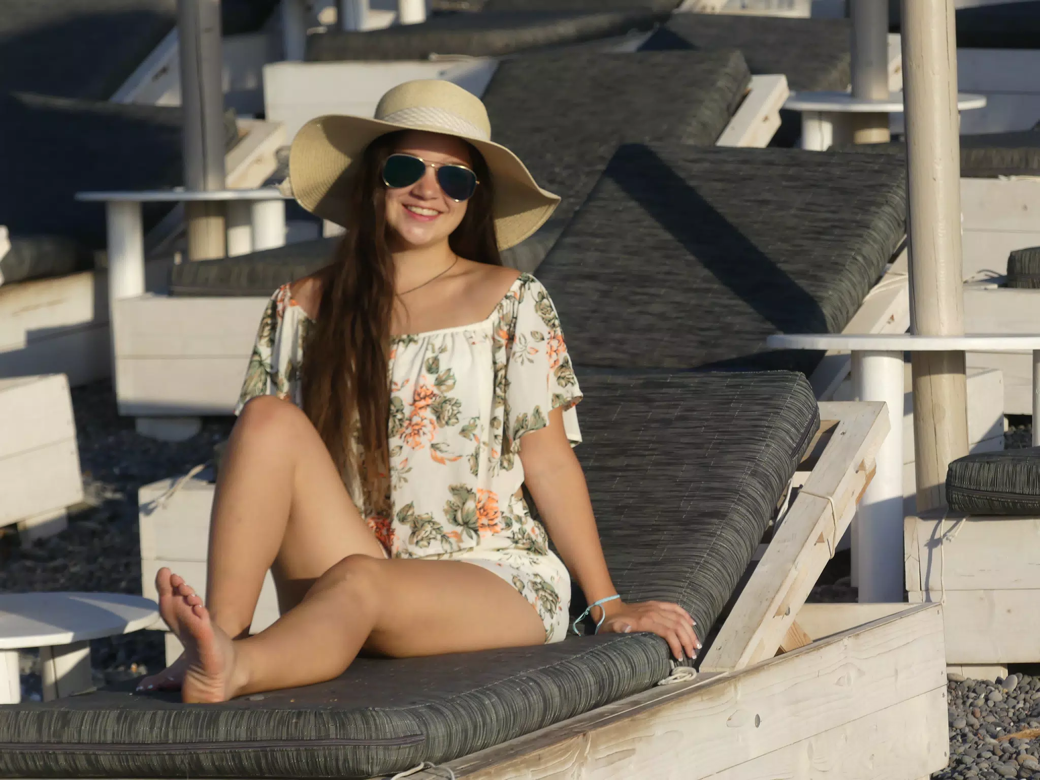 Emily on Lounge Chair on Santorini Beach