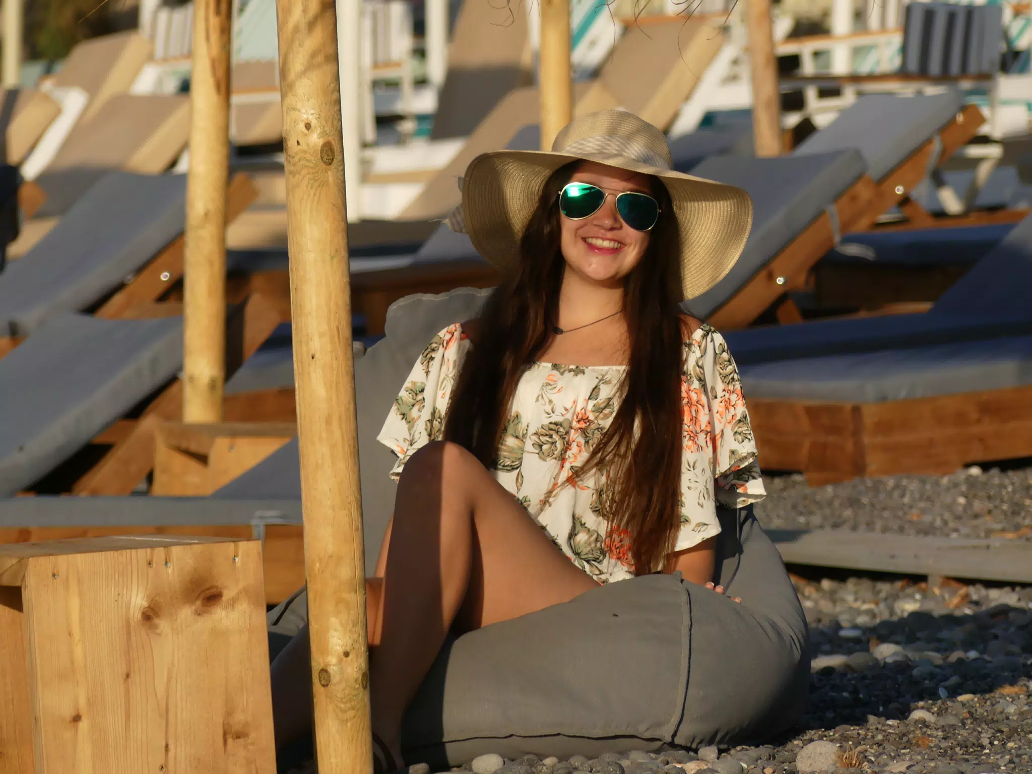 Girl in Hat on Beach Cushion