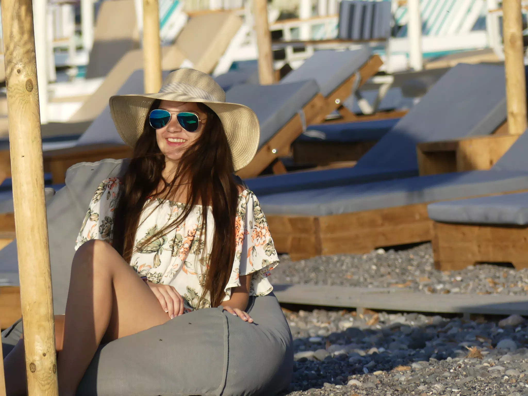 Girl in Hat on Beach Cushion