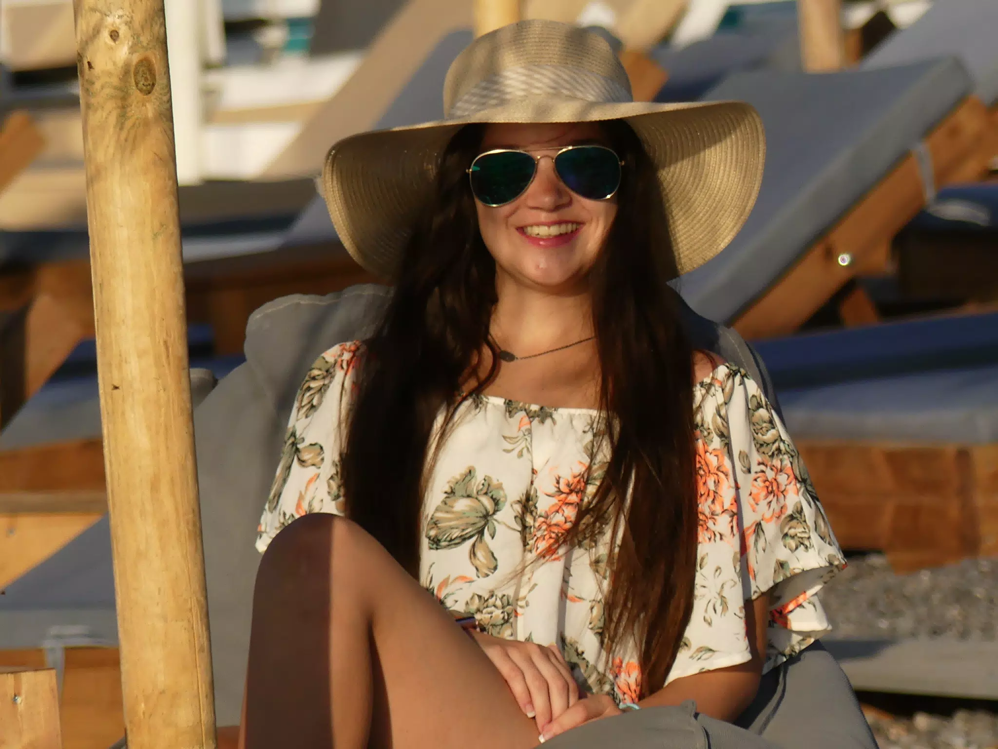 Girl in Hat on Beach Cushion