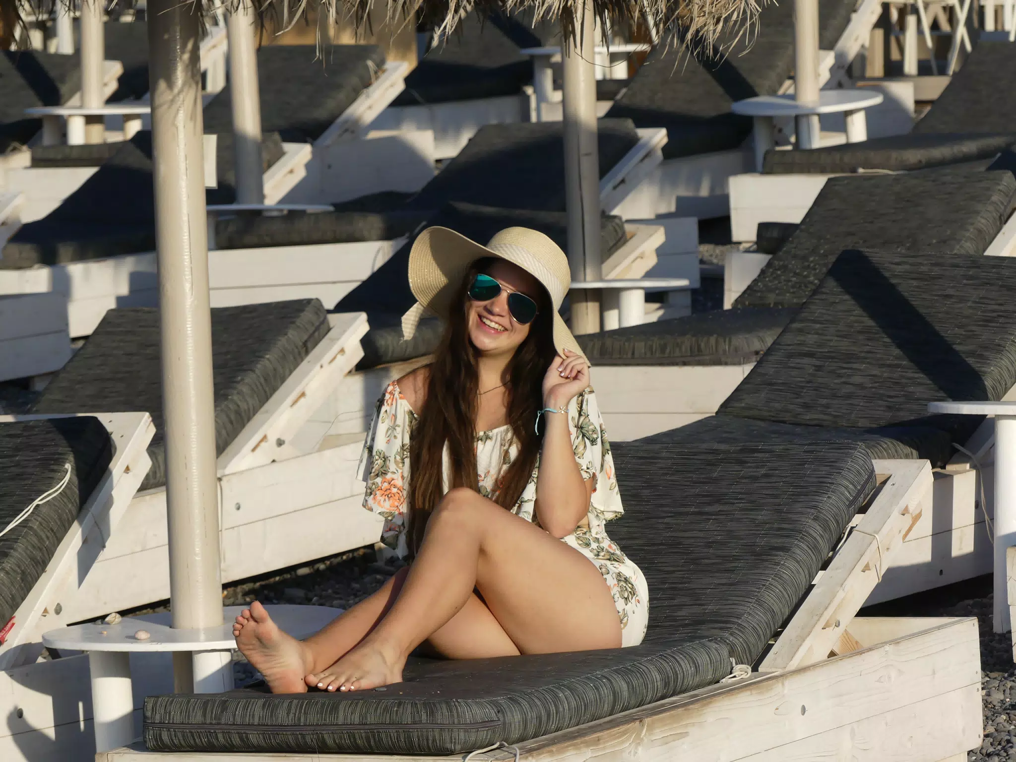 Girl with Hat at Sunrise on Kamari Beach on Santorini