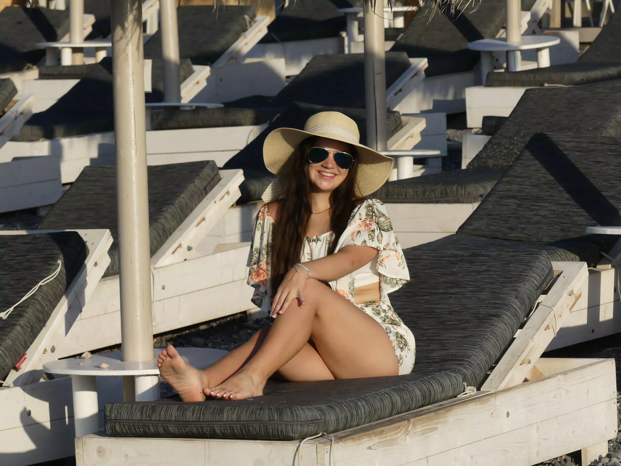 Emily Lounging Barefoot on Kamari Beach on Santorini
