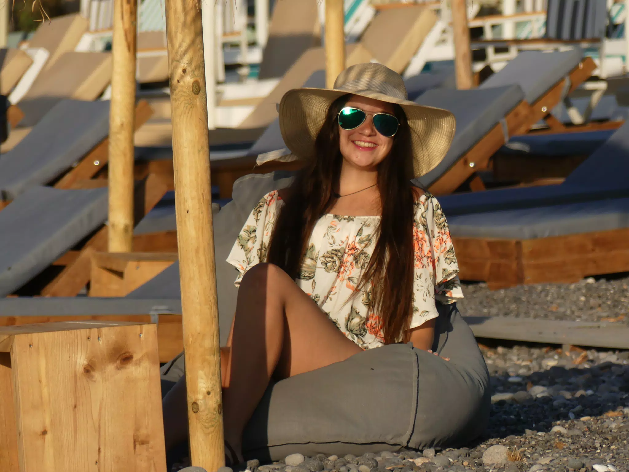 Emily in Hat on Beach Cusion on Santorini