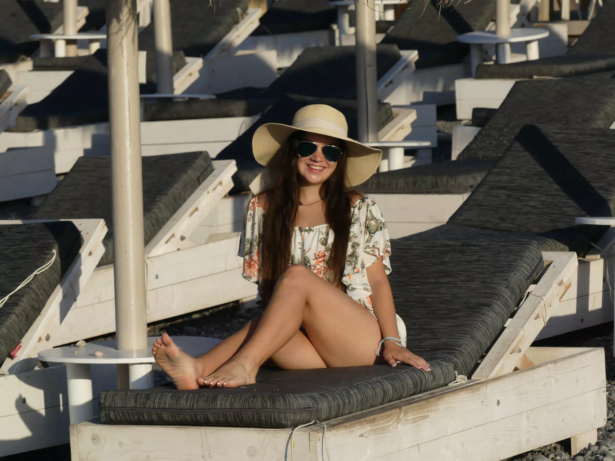 Emily Lounging Barefoot on Kamari Beach on Santorini