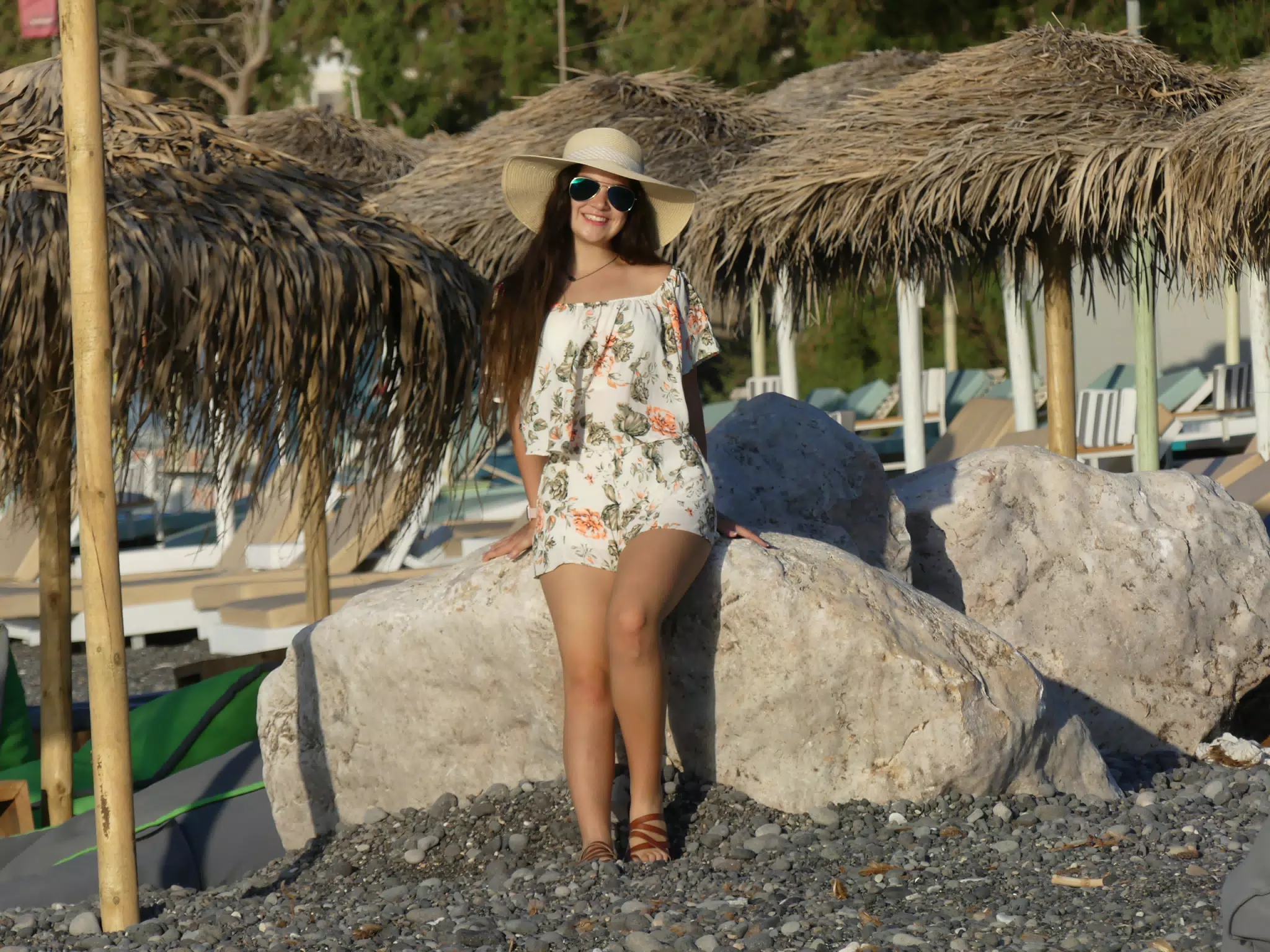 Girl Leaning on Rocks on Santorini Beach