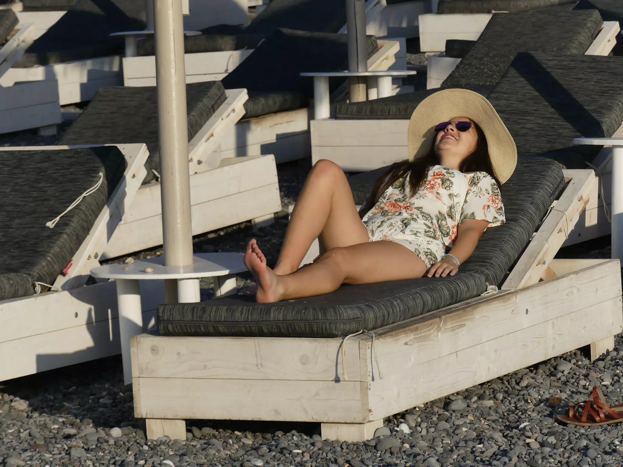Girl Getting Sun on Santorini Beach