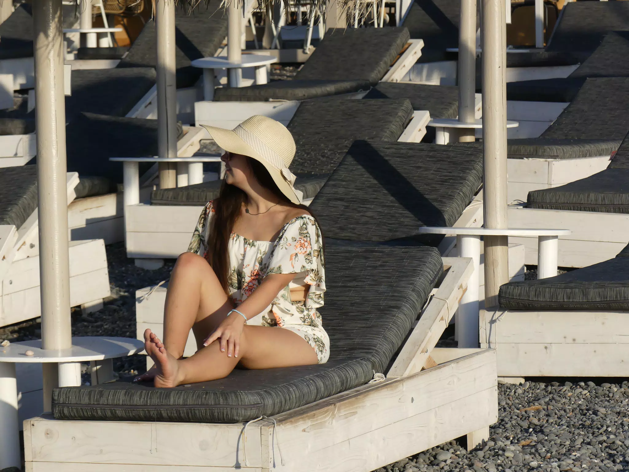 Girl on Lounge Chair on Beach on Santorini
