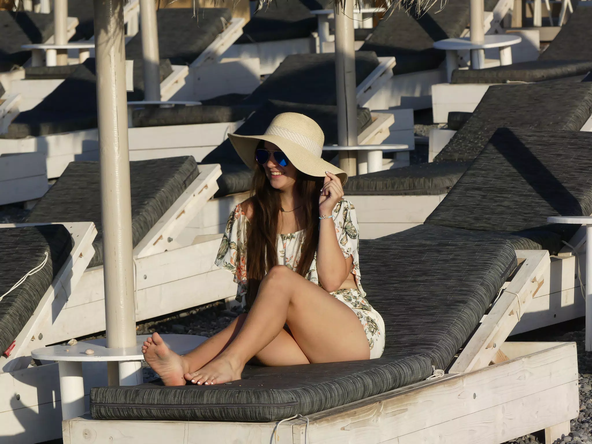 Girl with Hat on Kamari Beach on Santorini