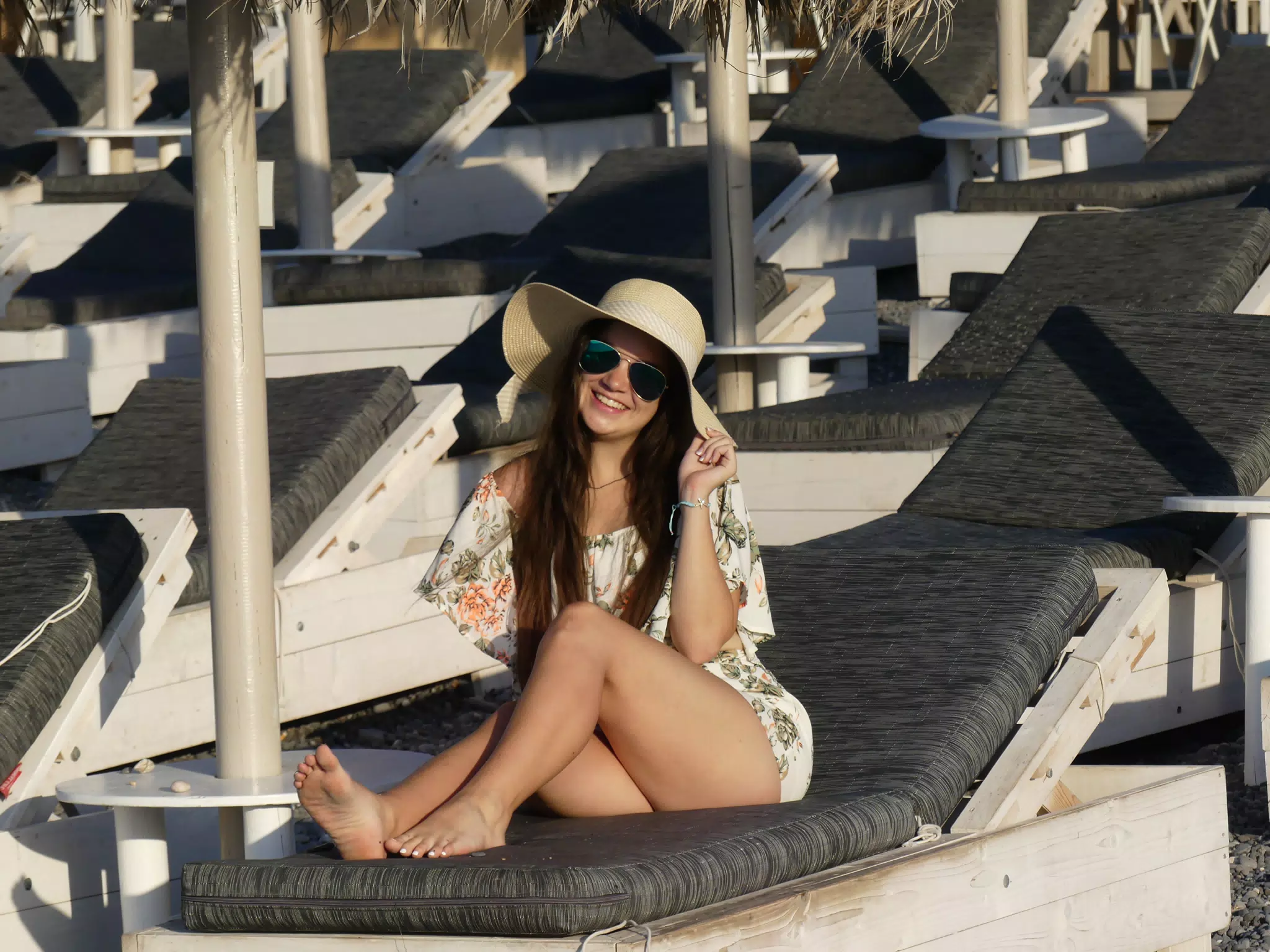 Girl with Hat on Kamari Beach on Santorini