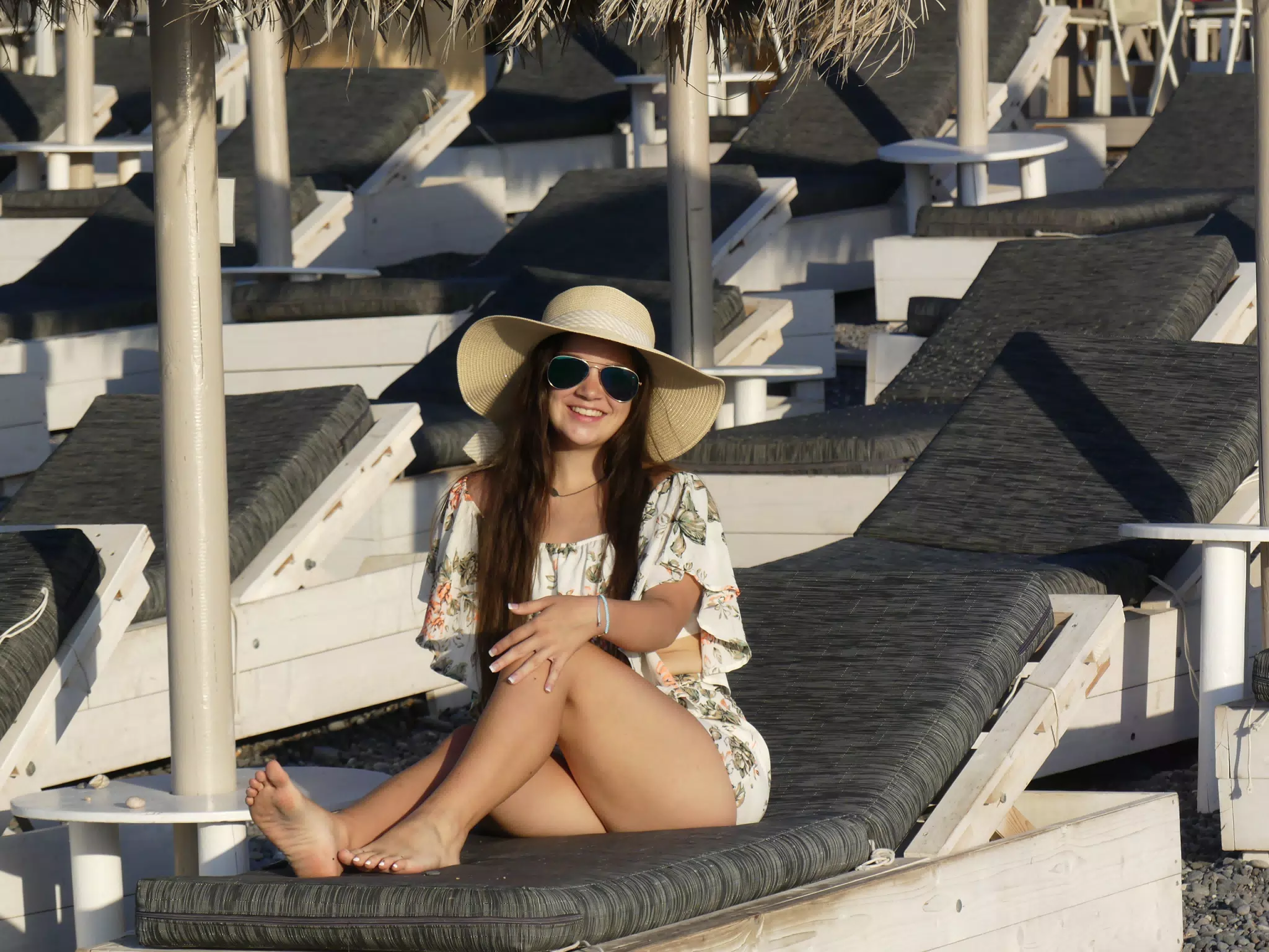 Barefoot Girl on Kamari Beach on Santorini