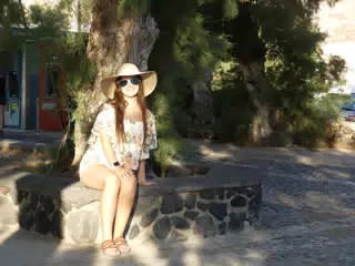 Emily Sitting Under Tree at Kamari Beach
