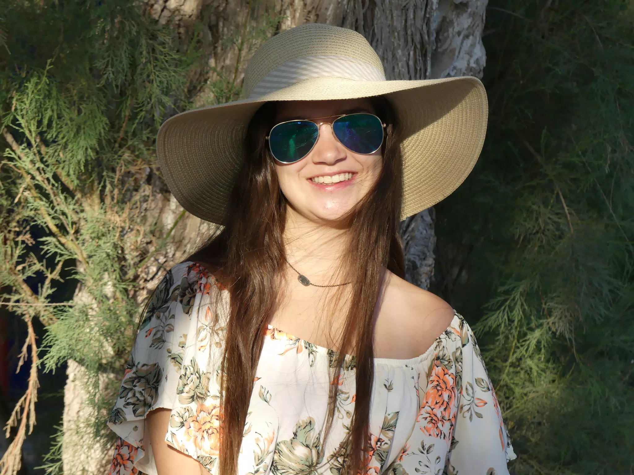 Girl in Hat by Tree at Kamari Beach