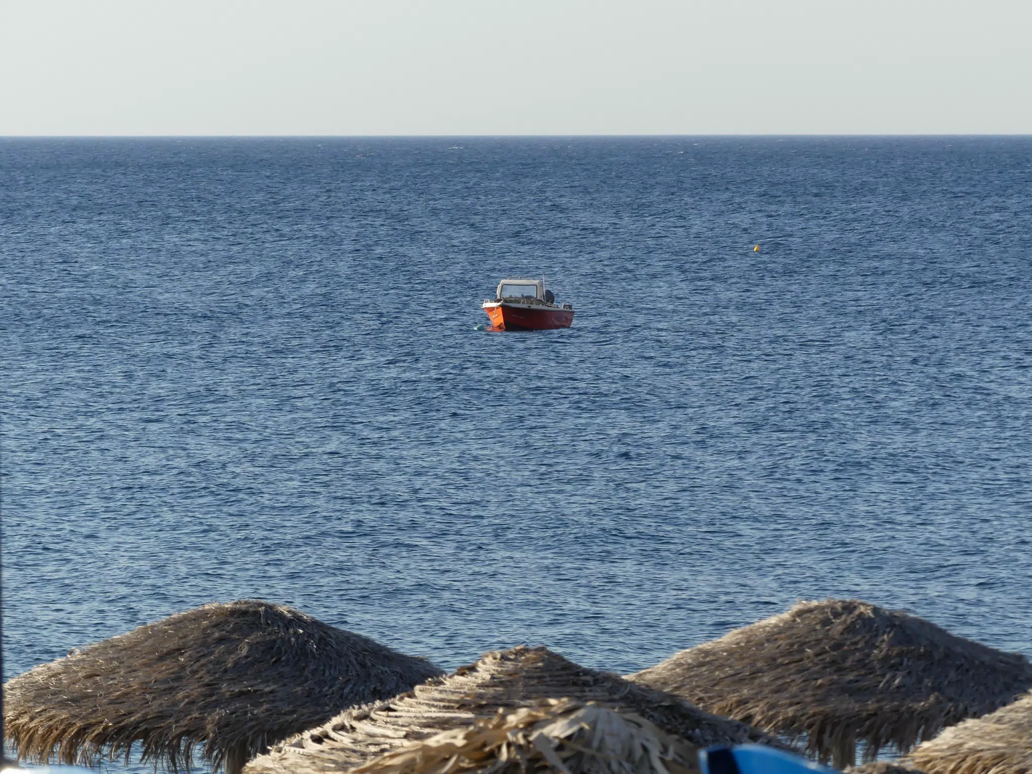 Boat in Aegean Sea off of Kamari, Santorini