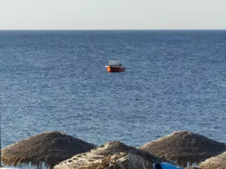 Boat in Aegean Sea off of Kamari, Santorini