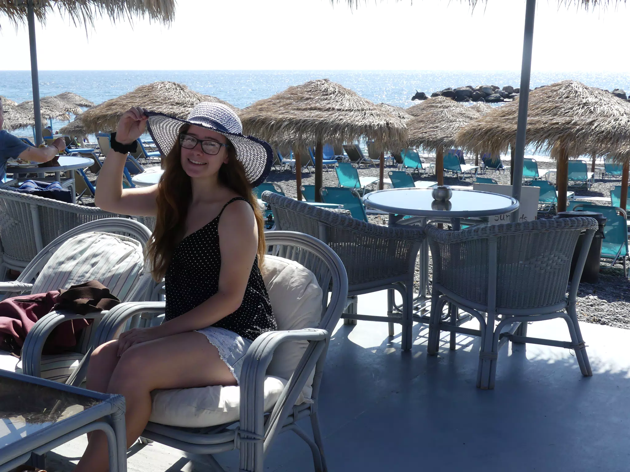 Madeline with Hat on Santorini Beach