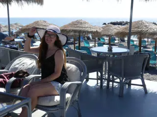 Madeline with Hat on Santorini Beach