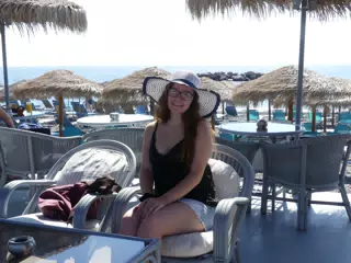 Madeline in Hat on Kamari Beach