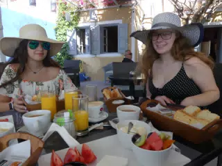 Emily and Madeline Having Breakfast on Kamari Beach on Santorini